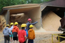 In action shot Casco Sawmill students tour