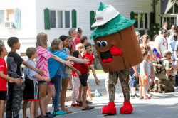 Forest Hancock giving out high fives at Casco Days.