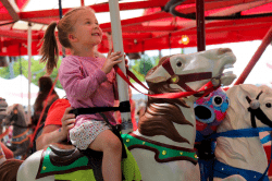 Enjoying the merry-go-round at Casco Days.